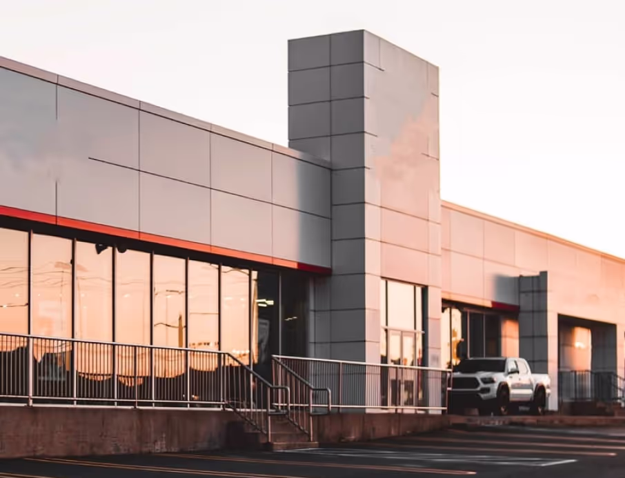 Storefront service building in Southern California at sunset with a pickup truck